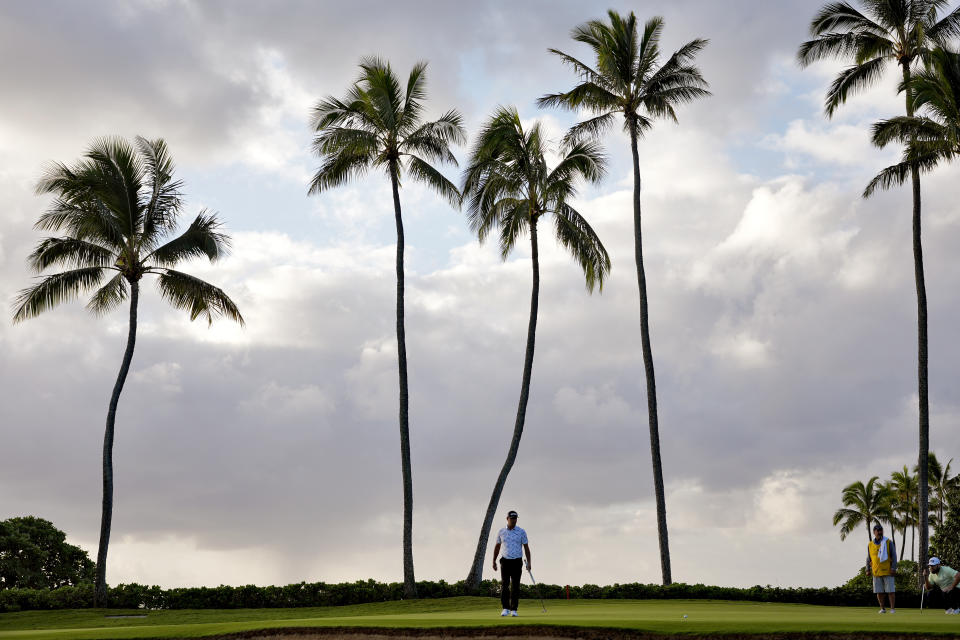 Gary Woodland watches his shot on the 11th green during the first round of the Sony Open golf event, Thursday, Jan. 11, 2024, at Waialae Country Club in Honolulu. (AP Photo/Matt York)