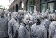 <p>Participants perform during the so called “1000 Figures” demonstration before the upcoming G20 summit in Hamburg, Germany, July 5, 2017. (Hannibal Hanschke/Reuters) </p>