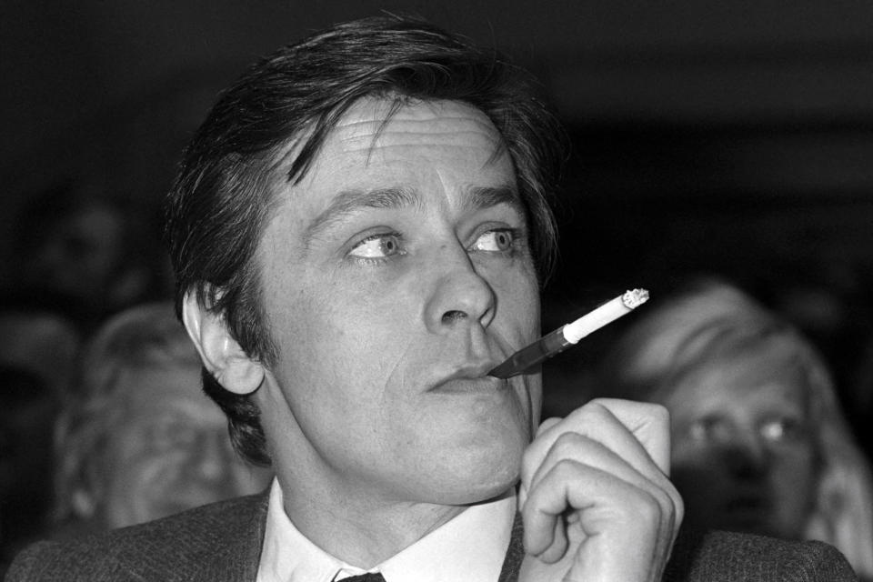 <p>TOPSHOT - A portrait taken on March 5, 1976 shows French actor Alain Delon smoking.  AFP PHOTO (Photo by AFP) (Photo by -/AFP via Getty Images)</p>
