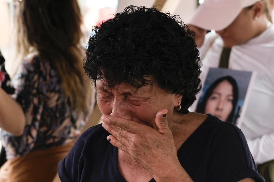 Cecilia Gonzalez, the mother of Amarirany Roblero, who went missing 12 years ago, cries during a protest outside an apartment rented by a suspected serial killer where evidence related to her daughter was found, in the Iztacalco neighborhood of Mexico City, Friday, April 26, 2024. Protesters covered the facade of the building with placards after investigators found the bones, cell phones and ID cards of several women at rented rooms there, asking variants of a single question: Why did it take prosecutors 12 years to investigate the disappearance of Amairany Roblero, then 18. (AP Photo/Marco Ugarte)