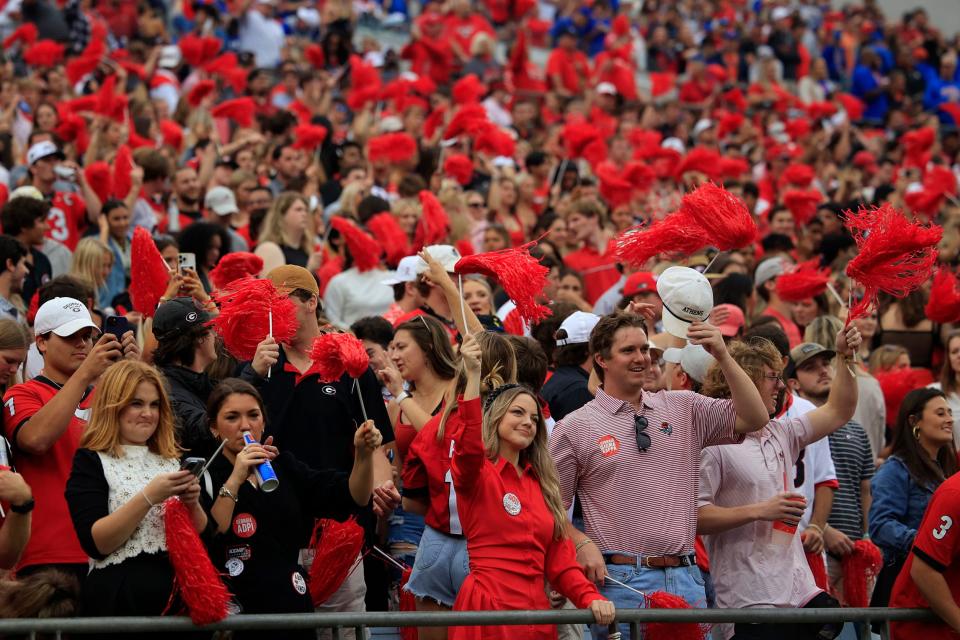 Georgia Bulldogs fans cheer during the first quarter of an NCAA football game on Oct. 29, 2022 at TIAA Bank Field in Jacksonville. The Georgia Bulldogs outlasted the Florida Gators 42-20.