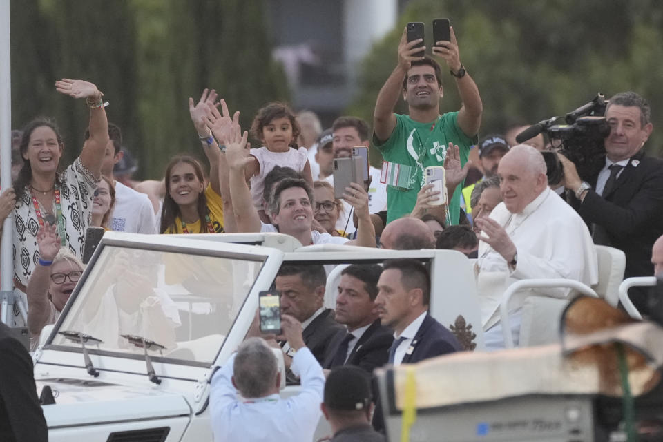 Pope Francis arives at the Parque Tejo in Lisbon, Saturday, Aug. 5, 2023, for a vigil ahead of the 37th World Youth Day. On Sunday morning, the last day of his five-day trip to Portugal, Francis is to preside over a final, outdoor Mass on World Youth Day – when temperatures in Lisbon are expected to top 40 degrees C (104F) – before returning to the Vatican. (AP Photo/Gregorio Borgia)