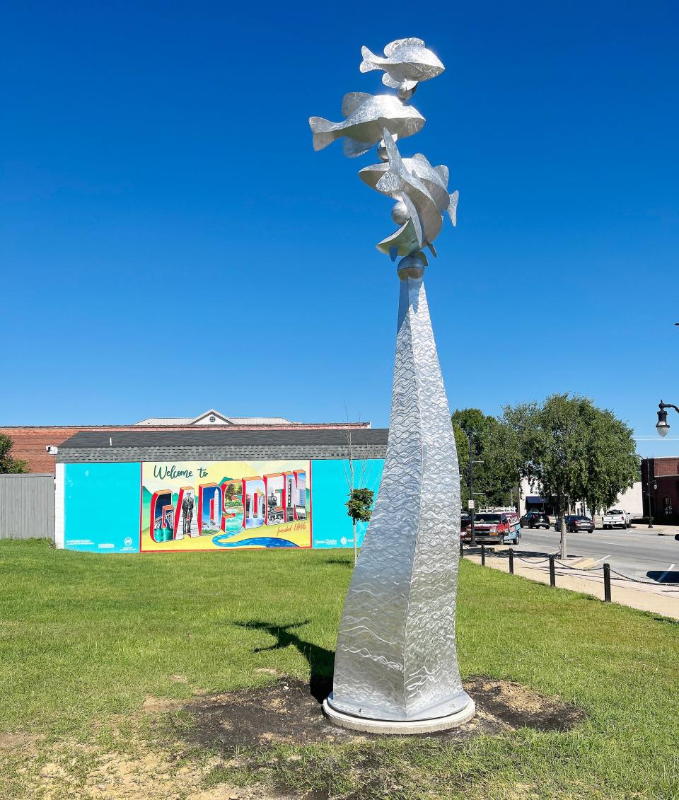 "River Whiskers," a kinetic sculpture commissioned by the Gadsden Public Arts Project, sits adjacent to the "Welcome to Gadsden" mural in a lot at Broad and first streets.