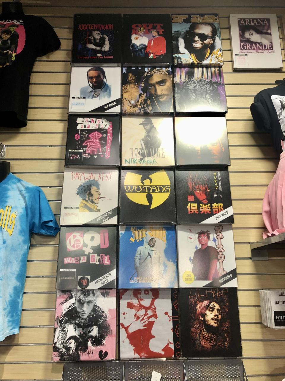 Selection of rap artist T-shirts on sale at Hot Topic