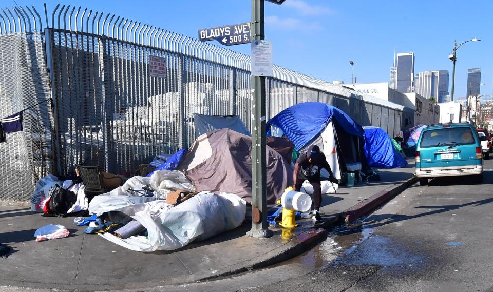 Tents where homeless residents sleep line a sidewalk near downtown Los Angeles on Jan. 8. (Photo: FREDERIC J. BROWN via Getty Images)