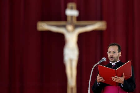 Yoannis Lahzi Gaid reads in Arabic during Pope Benedict's general audience in Saint Peter's Square at the Vatican October 10, 2012. To match Insight POPE-MANAGEMENT/ REUTERS/Max Rossi/File Photo