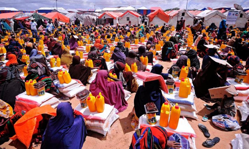 People receiving food aid at a distribution centre outside Mogadishu.