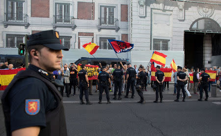 Far-right demonstrators shout slogans in favour of Spain's unity at people gathered for a separate demonstration in favour of Catalan independence referendum, in the Puerta del Sol in Madrid, Spain, September 20, 2017. REUTERS/Paul Hanna