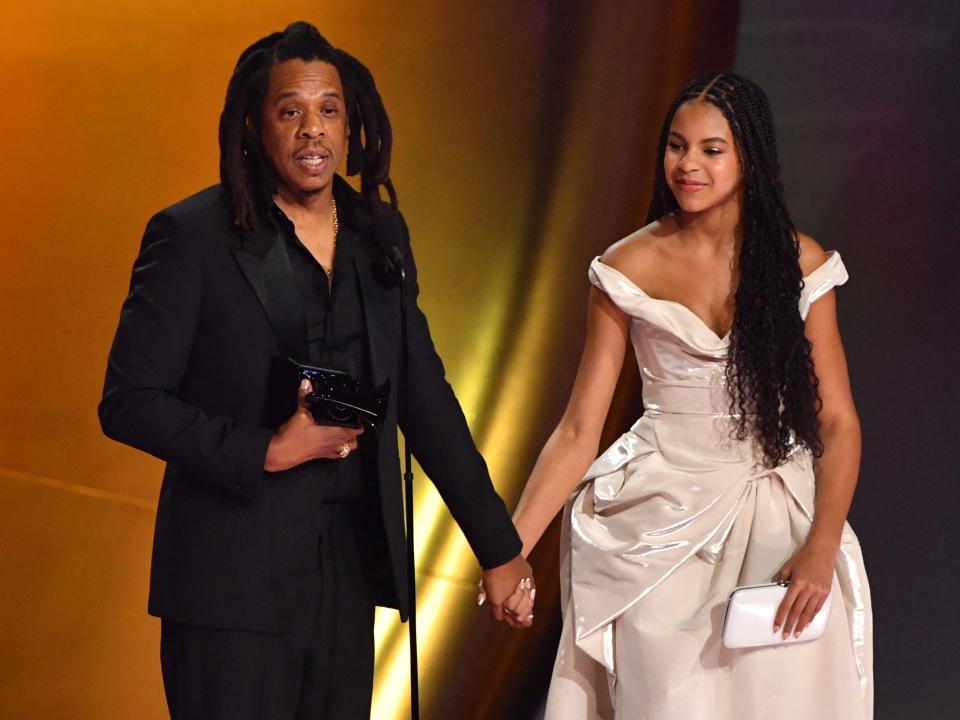 Jay-Z accepts the Dr. Dre Global Impact Award alongside his daughter Blue Ivy onstage during the 66th Annual Grammy Awards in Los Angeles on February 4, 2024.