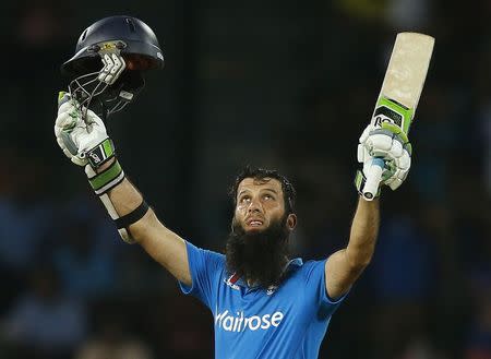 England's Moeen Ali celebrates his century during their first ODI (One Day International) cricket match against Sri Lanka in Colombo November 26, 2014. REUTERS/Dinuka Liyanawatte