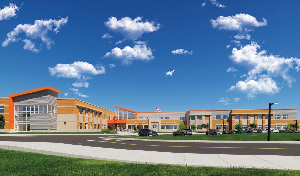 An artist's rendering shows the Massillon West Elementary School under construction behind the Massillon Intermediate and Junior High School on the city's west side. Officials broke ground on the school in December. Construction is expected to be completed in June 2025.