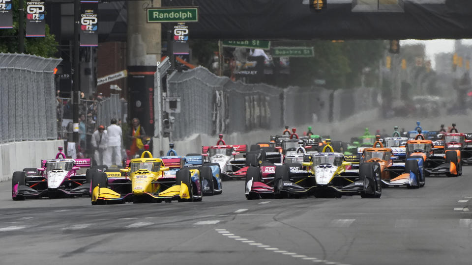 Colton Herta (26) leads the field during the IndyCar Detroit Grand Prix auto race in Detroit, Sunday, June 2, 2024. (AP Photo/Paul Sancya)