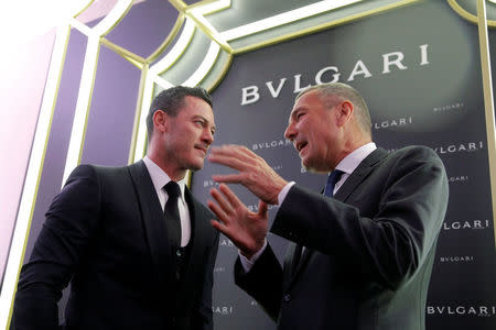 Bulgari Chief Executive Jean-Christophe Babin (R) talks to actor Luke Evans during a ribbon cutting ceremony to celebrate the opening of a new Bulgari store in Moscow, Russia, May 24, 2016. REUTERS/Maxim Shemetov