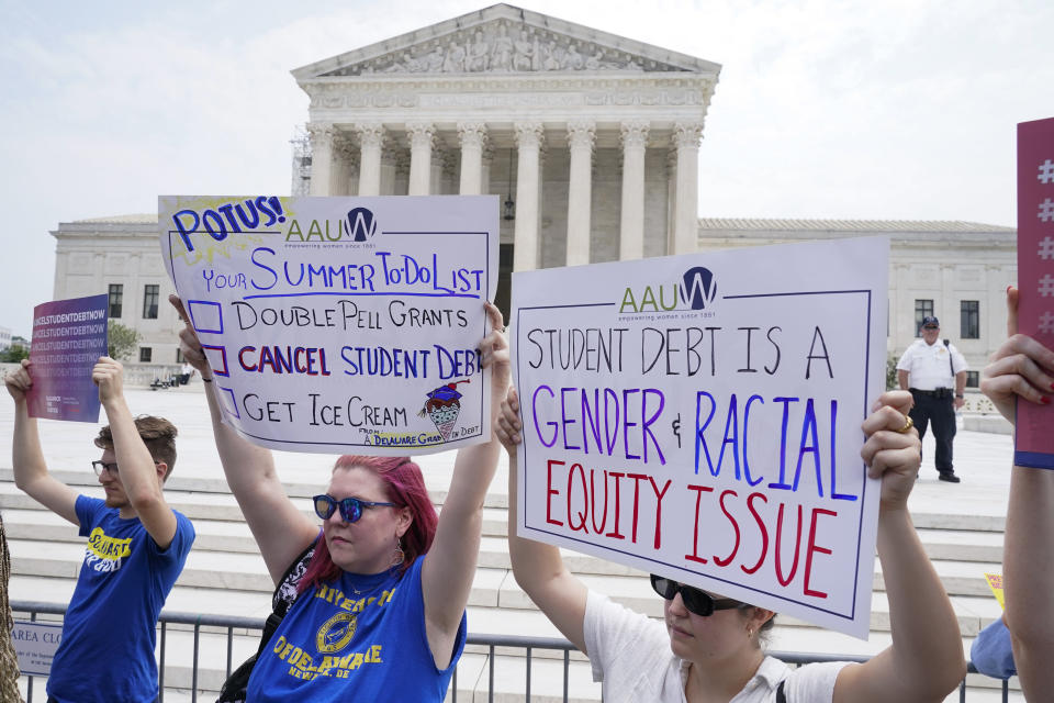 People demonstrate outside the Supreme Court, Friday, June 30, 2023, in Washington. A sharply divided Supreme Court has ruled that the Biden administration overstepped its authority in trying to cancel or reduce student loan debts for millions of Americans. Conservative justices were in the majority in Friday's 6-3 decision that effectively killed the $400 billion plan that President Joe Biden announced last year. (AP Photo/Jacquelyn Martin)