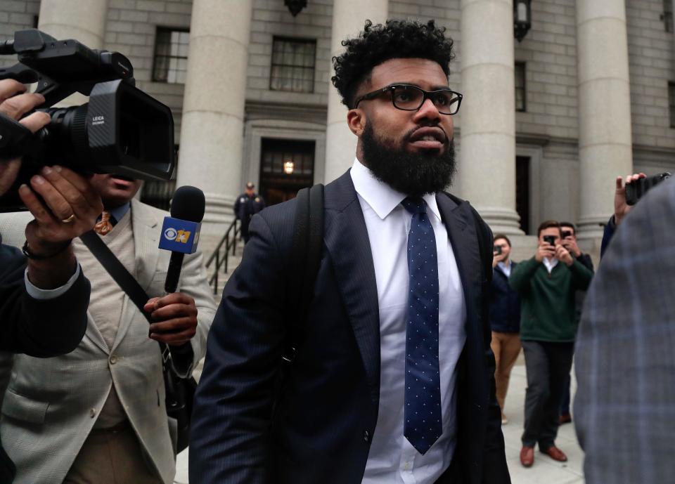 Dallas Cowboys NFL football star Ezekiel Elliott walks out of federal court on Nov. 9, 2017, in New York. Elliott's lawyers argued before a Manhattan federal appeals court on whether the Cowboys running back should be allowed to play while three judges decide the fate of his six-game suspension for alleged domestic violence.