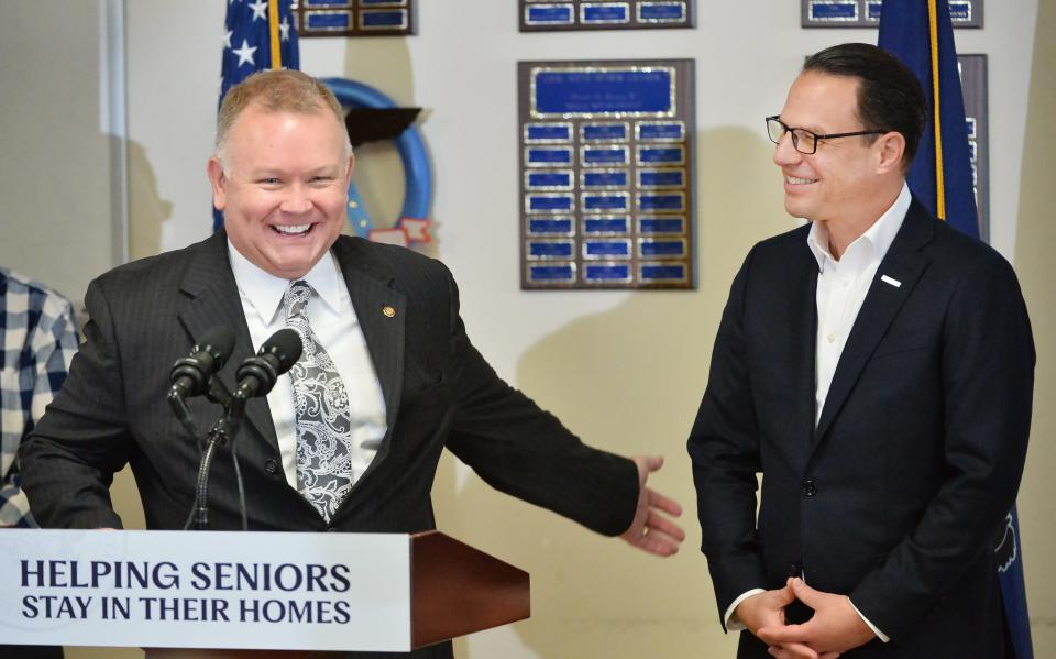 Pennsylvania state Rep. Pat Harkins, left, jokes with Gov. Josh Shapiro during a visit to the Erie West Senior Center to discuss property tax and rent rebate programs for seniors in May.