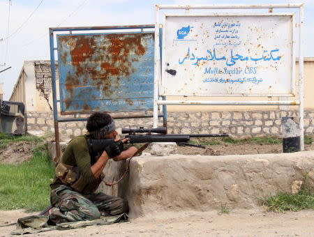 A member of Afghan security force takes his position during a battle with the Taliban on the outskirts of Kunduz province, Afghanistan, April 16, 2016. REUTERS/Stringer