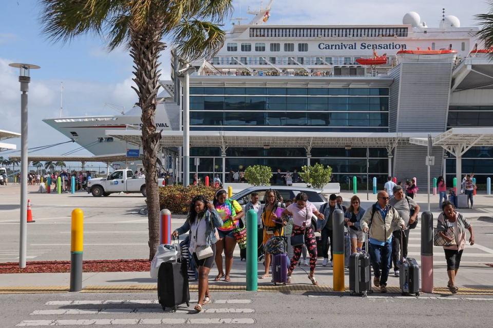 Cruisers disembark from the Carnival Sensation at PortMiami on Monday, March 9, 2020. The county-owned port is preparing a contingency plan to welcome back cruiseships that have coronavirus cases aboard.