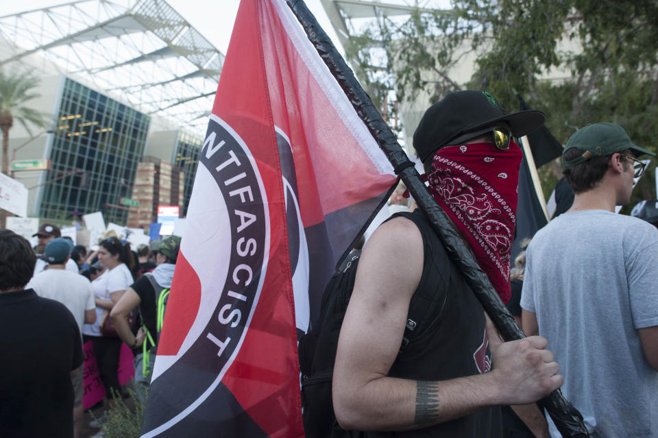 <p>Demonstrators gather outside the Phoenix, Arizona, Convention Center where US President Donald Trump will be speaking at a “Make America Great Again” rally on August 22, 2017. (Laura Segall/AFP/Getty Images) </p>