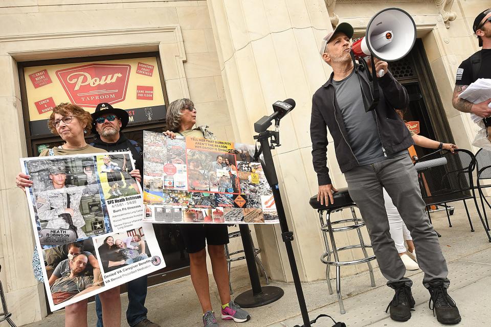 Jon Stewart, Political Commentator, Actor and Guest of Honor talks to the crowd of over 100 people Thursday April 14, 2022 in downtown Wilmington, N.C. outside of the offices U.S. Senator Richard Burr’s during a PACT Summit.  The event was in partnership with Burn Pits 360, The Grunt Style Foundation that delivered 17,000 signed petitions to U.S. Senator Richard Burr’s office steps, to advocate for the 3.5 million veterans affected by burn pit toxic exposure. [KEN BLEVINS/STARNEWS]