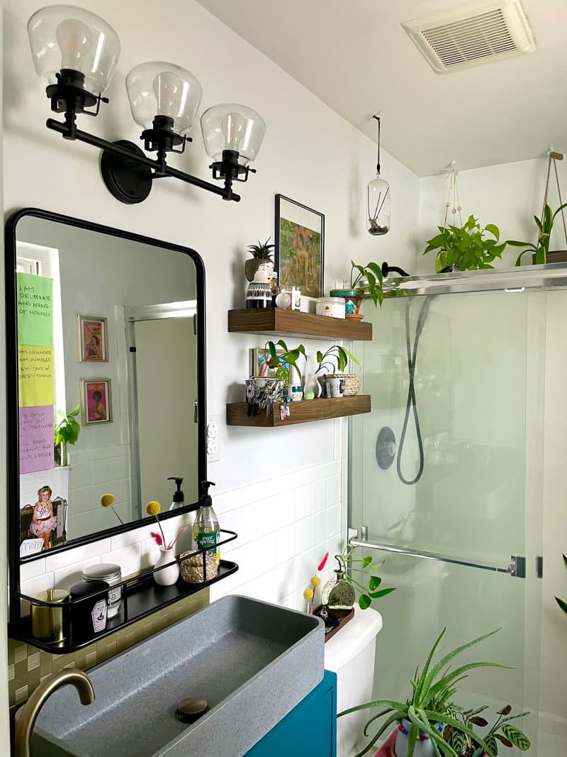 Plant filled bathroom.