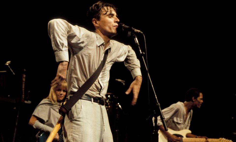 David Byrne in typical pose during Stop Making Sense.