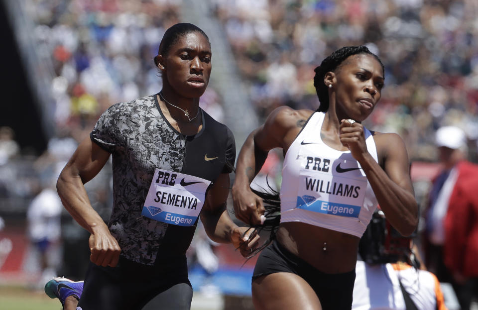 South Africa's Caster Semenya, left, runs next to United States' Chrishuna Williams during the women's 800-meter race during the Prefontaine Classic, an IAAF Diamond League athletics meeting, in Stanford, Calif., Sunday, June 30, 2019. Semenya won the race. (AP Photo/Jeff Chiu)