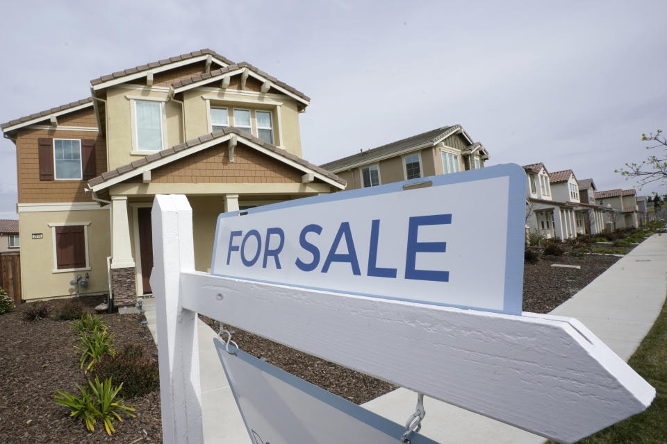 FILE - A for sale sign is posted in front of a home in Sacramento, Calif., March 3, 2022. The Biden administration is announcing new federal initiatives to increase access to affordable housing as high interest rates and still-high prices on groceries and other necessities have dramatically pushed up the cost of living in the post-pandemic years. Treasury Secretary Janet Yellen is traveling to Minneapolis on Monday, June 24, 2024, to promote the new investments. (AP Photo/Rich Pedroncelli, File)