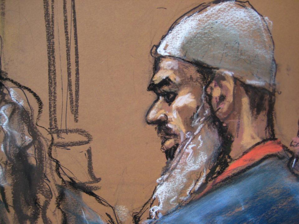 Suleiman Abu Ghaith stands in front of U.S. District Judge Lewis Kaplan (not shown) during his sentencing on terrorism charges, as seen in this courtroom drawing in New York September 23, 2014. Abu Ghaith, a son-in-law of Osama bin Laden, was sentenced to life in prison on Tuesday in New York following his conviction on terrorism charges. REUTERS/Jane Rosenberg (UNITED STATES - Tags: CRIME LAW) FOR EDITORIAL USE ONLY. NOT FOR SALE FOR MARKETING OR ADVERTISING CAMPAIGNS. THIS IMAGE HAS BEEN SUPPLIED BY A THIRD PARTY. IT IS DISTRIBUTED, EXACTLY AS RECEIVED BY REUTERS, AS A SERVICE TO CLIENTS