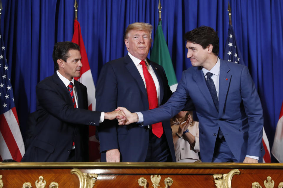 President Trump, Canada’s Prime Minister Justin Trudeau, right, and Mexico’s President Enrique Pena Neto, left, participate in the USMCA signing ceremony on Friday in Buenos Aires, Argentina. (Photo: Pablo Martinez Monsivais/AP)