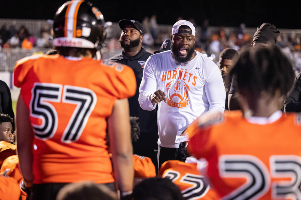 Hawthorne head coach Cornelius Ingram talks to his players during halftime of the Union County game last Friday night.