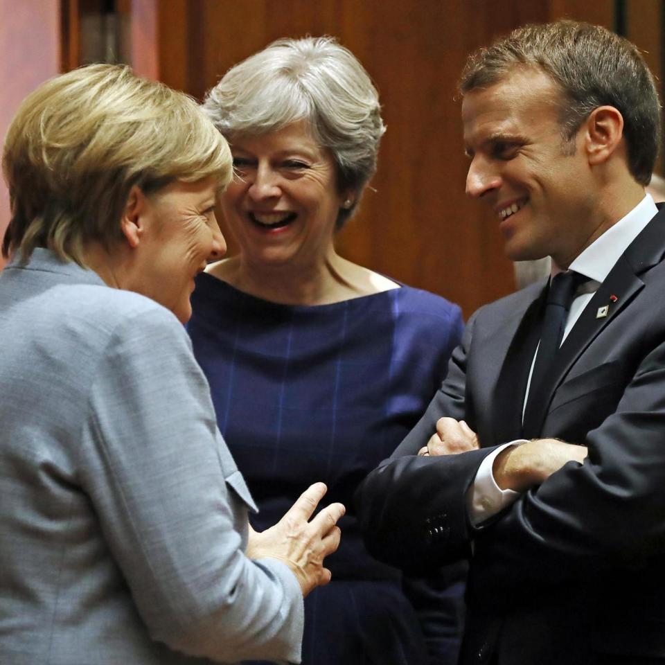 Negotiations: The three world leaders chatted together at the start of the summit (Getty Images)