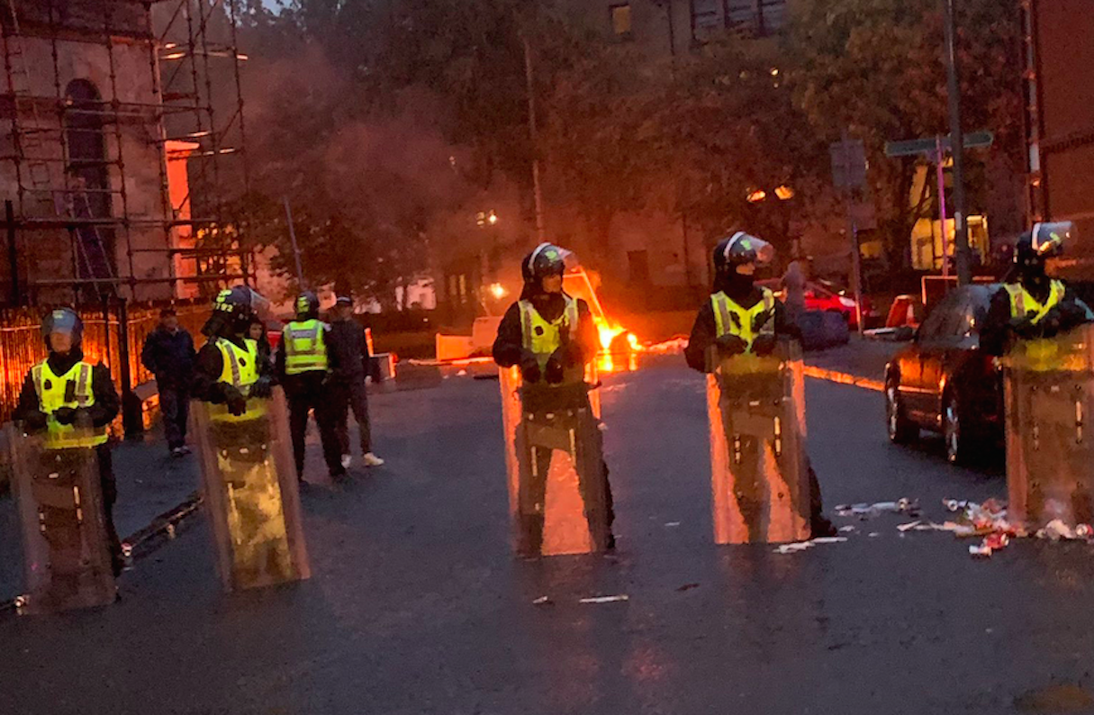 Police form a line after trouble flared in Glasgow on Friday night (Picture: PA)