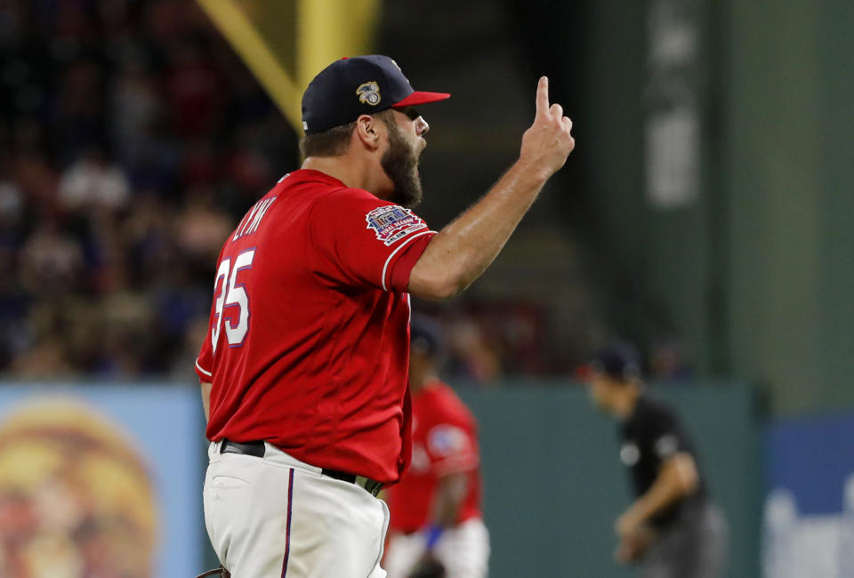 Texas Rangers' Lance Lynn celebrates after getting Los Angeles Angels' Shohei Ohtani to fly out to end the top of the seventh inning of a baseball game in Arlington, Texas, Thursday, July 4, 2019. (AP Photo/Tony Gutierrez)