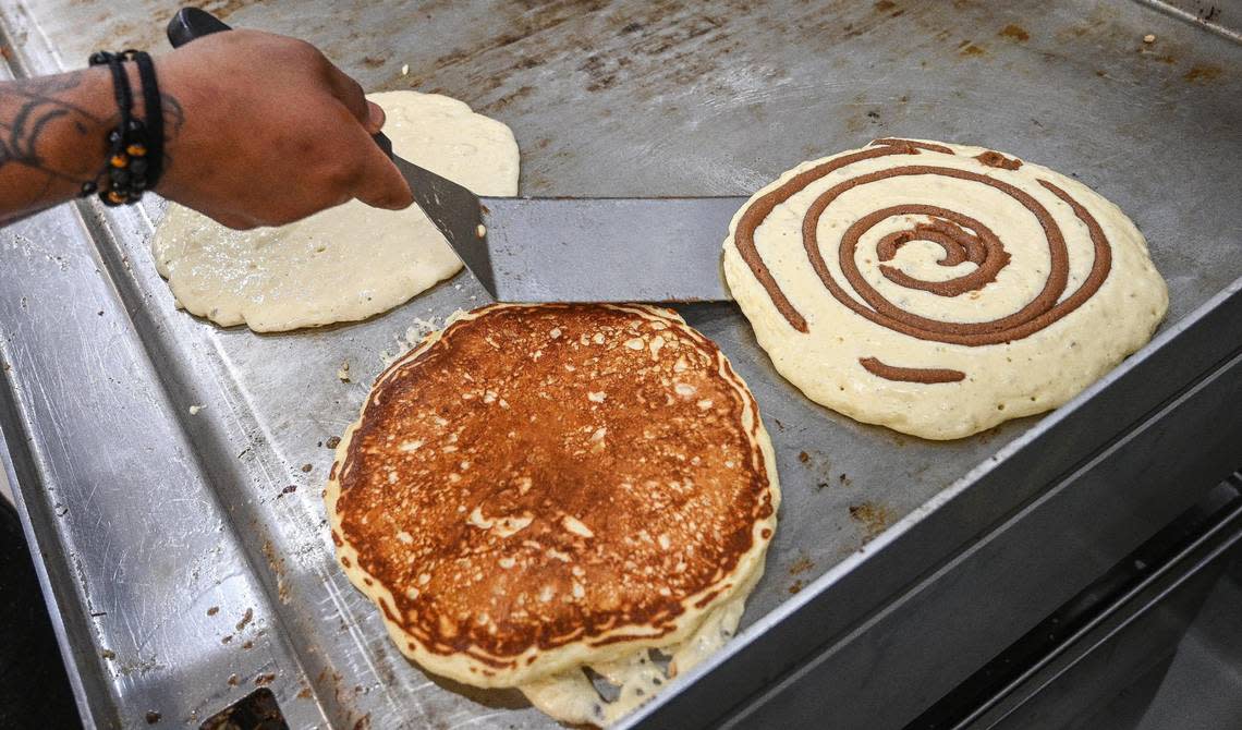 Cinnamon pancakes featuring handmade ingredients from scratch are prepared at Batter Up Pancakes at the restaurant’s new location in Clovis on Wednesday, Feb. 22, 2023.