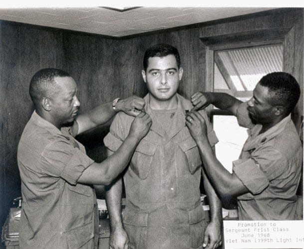 Johnny Velasquez gets fitted for his military uniform in June of 1968.