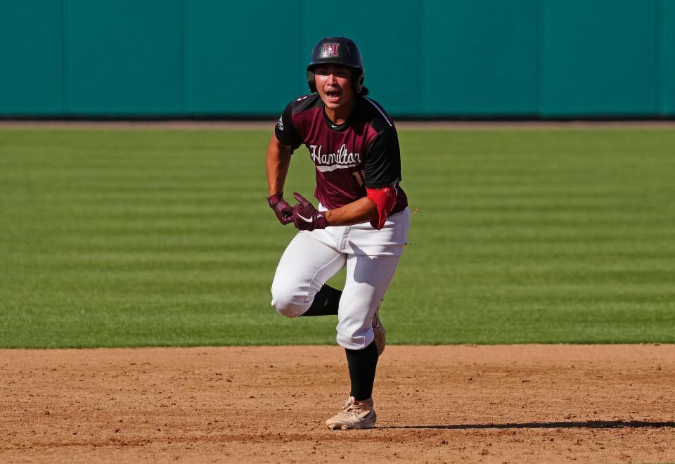 Hamilton catcher Liam Wilson (10) celebrates a home run against Sandra Day O’Connor during a 6A State Semifinal game on May 12, 2023, at Hohokam Stadium in Mesa.