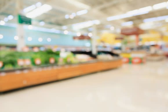 A blurry picture of the interior of a grocery store