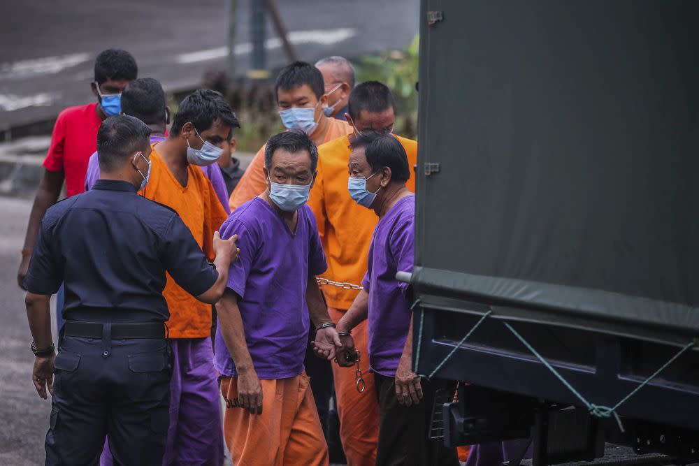 The suspects from a company allegedly responsible for Sungai Selangor’s odour pollution arrive at the Selayang Magistrate’s Court October 21, 2020. — Picture by Hari Anggara
