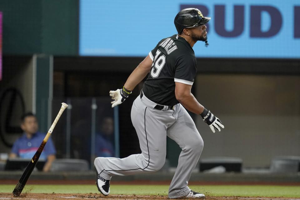 Chicago White Sox's Jose Abreu watches his single during the first inning of the team's baseball game against the Texas Rangers, Thursday, Aug. 4, 2022, in Arlington, Texas. (AP Photo/Tony Gutierrez)