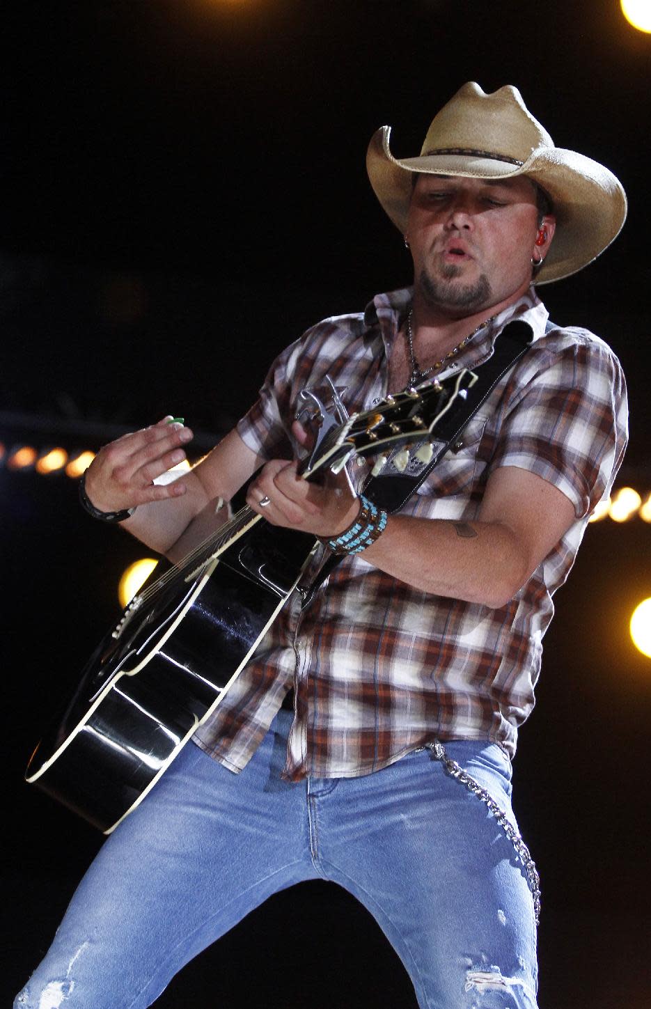 FILE - This June 7, 2012 file photo shows country singer Jason Aldean performing at the 2012 CMA Festival in Nashville, Tenn. Aldean's next album, "Night Train," will be released on Oct. 16. (Photo by Wade Payne/Invision/AP, file)