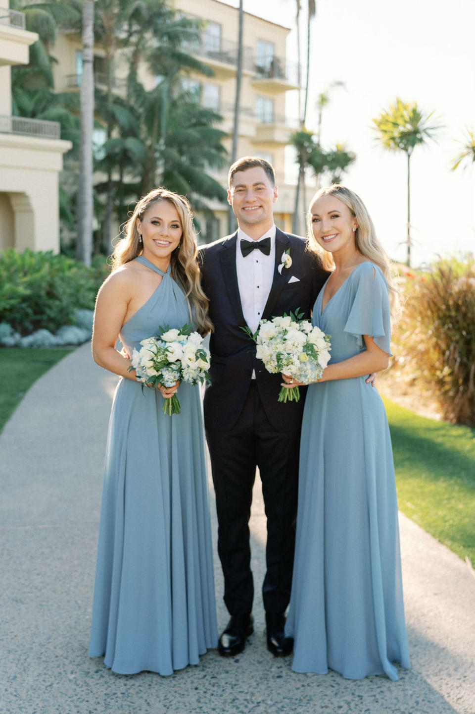 Brother dances with 2 sisters at wedding after mom died (Courtesy Kristina Adams)