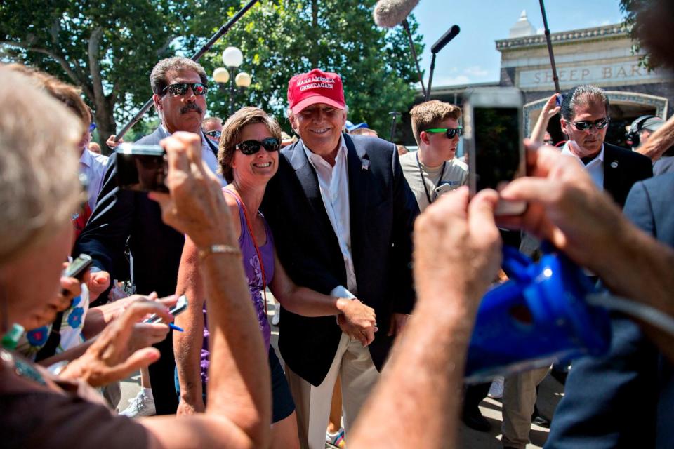 PHOTO: Donald Trump, president and chief executive of Trump Organization Inc. and 2016 Republican presidential candidate, greets attendees as he tours the Iowa State Fair in Des Moines, Iowa, Aug. 15, 2015.  (Daniel Acker/Bloomberg via Getty Images )