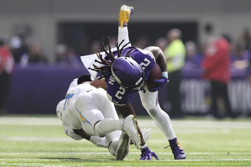 Chargers safety Derwin James Jr. tackles Vikings running back Alexander Mattison (2).