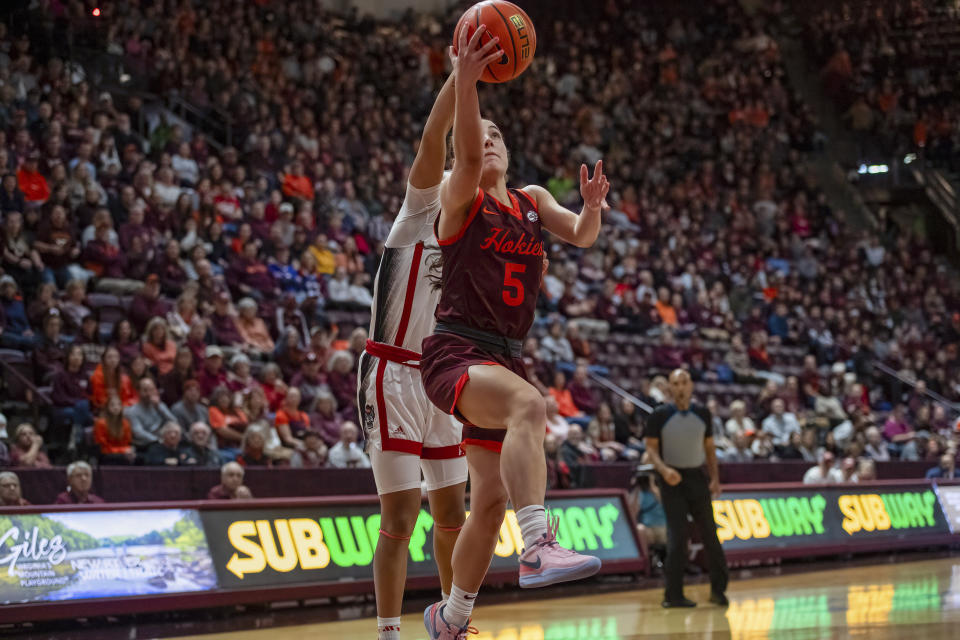 Virginia Tech's Georgia Amoore sets up a shot during the first half of an NCAA college basketball game against North Carolina State, Sunday, Jan. 7, 2024, in Blacksburg, Va. (AP Photo/Robert Simmons)