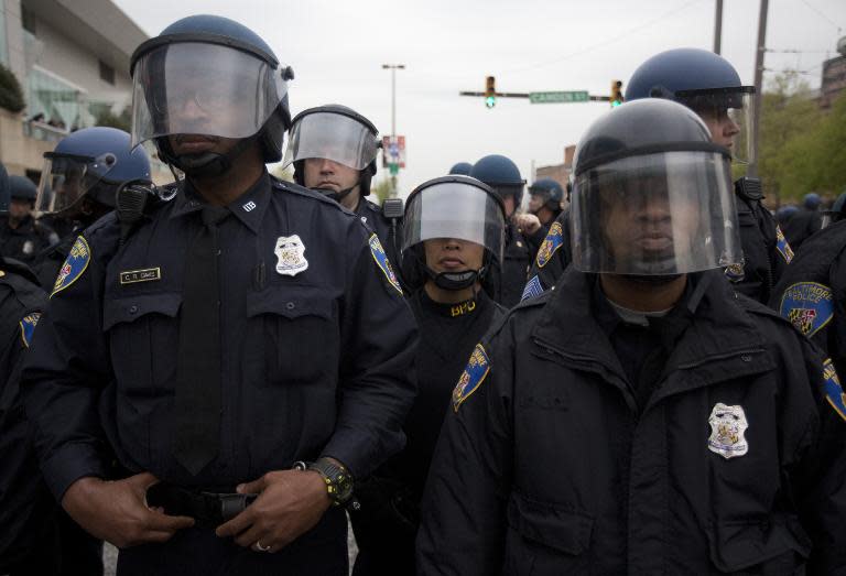 Police hold their position during a demonstration in Baltimore, Maryland, on April 25, 2015, against the death of Freddie Gray while in police custody