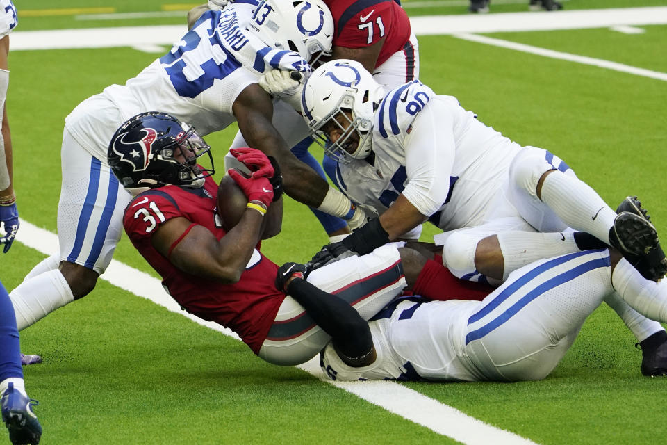 Houston Texans running back David Johnson (31) scores a touchdown against the Indianapolis Colts during the first half of an NFL football game Sunday, Dec. 6, 2020, in Houston. (AP Photo/David J. Phillip)