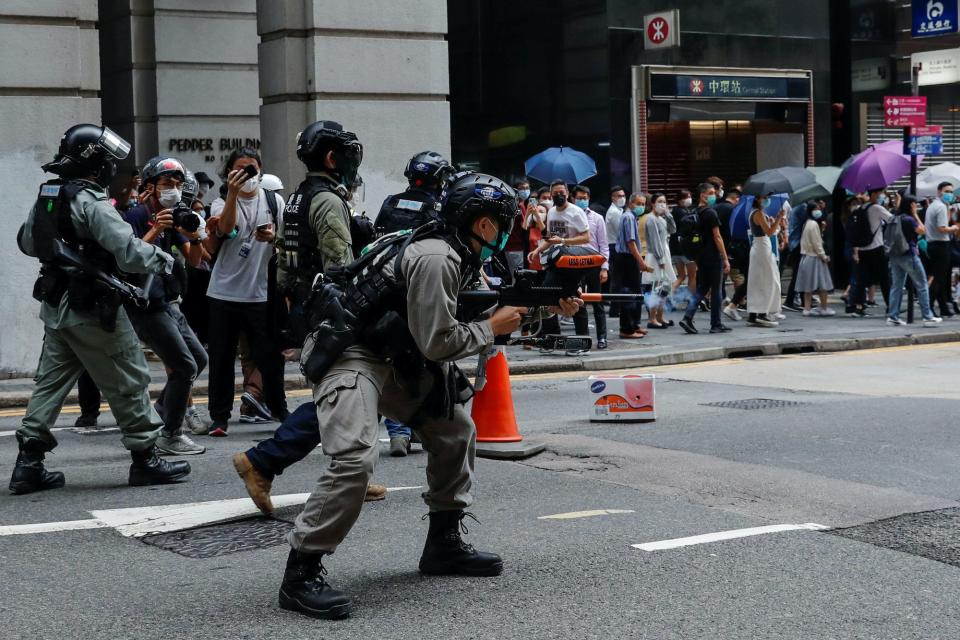 Hong Kong police shoot at protesters.JPG