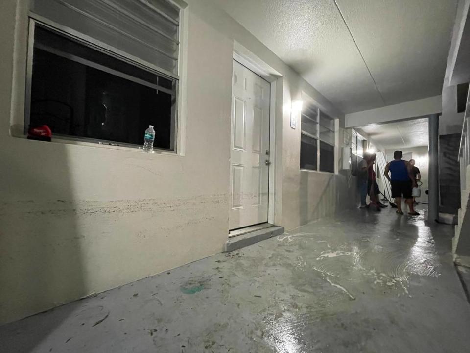Boys and young men clean up one last layer of mud from the floor of a common area of the Stillwater Cove apartments in Naples’ River Park neighborhood on Saturday, Oct. 1, 2022. Hurricane Ian’s storm surge caused many first-floor units to flood on Wednesday, Sept. 28.