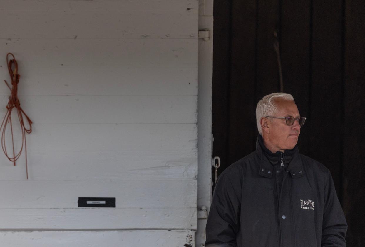 Trainer Todd Pletcher surveys his barn area as his Kentucky Derby entry, Fierceness, is bathed following a morning workout at Churchill Downs. Special to the Courier Journal by Pat McDonogh. April 23, 2024